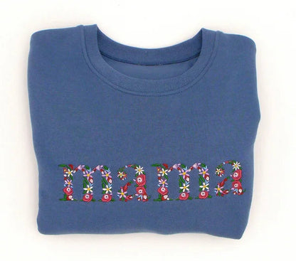 Trui met bloementekst vanconcepts.be